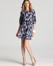 Julie Dillon's feather printed dress lends low-key chic in a shift silhouette--a belted waist gives a flattering fit. Julie Dillon's feather printed dress lends low-key chic in a shift silhouette--a belted waist gives a flattering fit.
