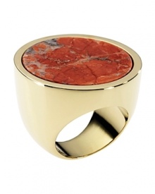 Crafted of gold tone with a boldly colored coral howlite stone, this disc-shaped ring from MICHAEL Michael Kors is a natural focal point. Crafted of gold tone with a boldly colored coral howlite stone, this disc-shaped ring from MICHAEL Michael Kors is a natural focal point.