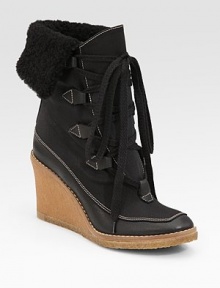 Comfortable nylon design with a crepe wedge, fold-over dyed shearling cuff and unique lace-up front Crepe wedge, 3 (75mm) Covered platform, ½ (15mm) Compares to a 2½ heel (65mm) Nylon upper Dyed shearling cuff Leather lining Crepe sole Padded insole Made in ItalyOUR FIT MODEL RECOMMENDS ordering true whole size; ½ sizes should order the next whole size up. 