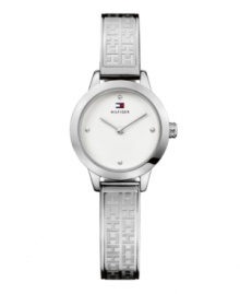 Stamped logos accent the sophisticated steel of this bracelet watch by Tommy Hilfiger. Logo-embossed stainless steel bangle bracelet and round case. Silver tone dial features dot markers at twelve, three, six and nine o'clock, two hands and logo. Quartz movement. Water resistant to 30 meters. Ten-year limited warranty. Stamped logos accent the sophisticated steel of this bracelet watch by Tommy Hilfiger. Logo-embossed stainless steel bangle bracelet and round case. Silver tone dial features dot markers at twelve, three, six and nine o'clock, two hands and logo. Quartz movement. Water resistant to 30 meters. Ten-year limited warranty.