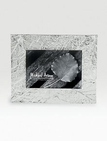 Delicately veined impressions of fallen leaves add a sylvan glow to favorite photos. Fits a 5 X 7 photoSilverplated and tarnish resistantHandmade in India