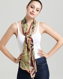 A sheer oblong scarf featuring a gorgeous tropical flora print and signature logo at hem. A sheer oblong scarf featuring a gorgeous tropical flora print and signature logo at hem.