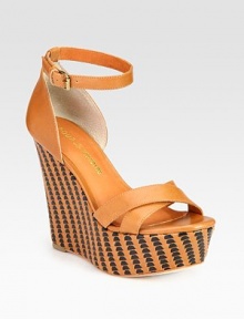 Luscious leather upper elevated by a woven wedge and platform. Self-covered wedge, 5 (125mm)Covered platform, 2 (50mm)Compares to a 3 heel (75mm)Leather upperLeather lining and solePadded insoleImportedOUR FIT MODEL RECOMMENDS ordering one half size up as this style runs small. Luscious leather upper elevated by a woven wedge and platform. Self-covered wedge, 5 (125mm)Covered platform, 2 (50mm)Compares to a 3 heel (75mm)Leather upperLeather lining and solePadded insoleImportedOUR FIT MODEL RECOMMENDS ordering one half size up as this style runs small.