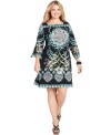 Get a standout look with Style&co.'s three-quarter sleeve plus size dress, featuring a striking print.