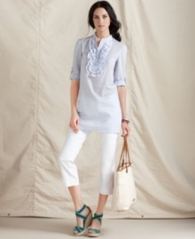 Ruffles, stripes and a relaxed tunic shape make for an essentially preppy look from Tommy Hilfiger. Pair it with white capris for a fresh on-trend look! Ruffles, stripes and a relaxed tunic shape make for an essentially preppy look from Tommy Hilfiger. Pair it with white capris for a fresh on-trend look!