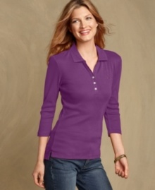 The polo top gets a sporty-chic update with a slim fit and a V-neckline in Tommy Hilfiger's preppy must-have. The polo top gets a sporty-chic update with a slim fit and a V-neckline in Tommy Hilfiger's preppy must-have.