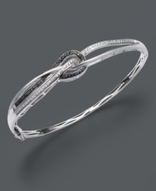 Tie up all the loose ends with this complementary black and white bangle. Chic knot design by Wrapped in Love(tm) features round-cut black diamonds (1/8 ct. t.w) and sparkling white diamond accents in a sterling silver setting. Approximate diameter: 2-1/2 inches. Tie up all the loose ends with this complementary black and white bangle. Chic knot design by Wrapped in Love(tm) features round-cut black diamonds (1/8 ct. t.w) and sparkling white diamond accents in a sterling silver setting. Approximate diameter: 2-1/2 inches.