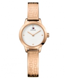 Stamped logos accent the vibrant tone of this bracelet watch by Tommy Hilfiger. Logo-embossed rose-gold-plated stainless steel bangle bracelet and round case. White dial features dot markers at twelve, three, six and nine o'clock, two hands and logo. Quartz movement. Water resistant to 30 meters. Ten-year limited warranty. Stamped logos accent the vibrant tone of this bracelet watch by Tommy Hilfiger. Logo-embossed rose-gold-plated stainless steel bangle bracelet and round case. White dial features dot markers at twelve, three, six and nine o'clock, two hands and logo. Quartz movement. Water resistant to 30 meters. Ten-year limited warranty.