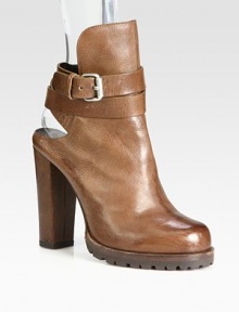 A classic shearling-lined mule is updated with a towering heel and wrap-around ankle strap. Self-covered heel, 4½ (115mm)Covered platform, ½ (15mm)Compares to a 4 heel (100mm)Distressed leather upperWrap-around adjustable ankle strapLeather liningRubber trek solePadded insoleMade in Italy A classic shearling-lined mule is updated with a towering heel and wrap-around ankle strap. Self-covered heel, 4½ (115mm)Covered platform, ½ (15mm)Compares to a 4 heel (100mm)Distressed leather upperWrap-around adjustable ankle strapLeather liningRubber trek solePadded insoleMade in Italy