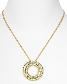 Nadri's sinuous pendant doubles up the texture trend with crystals dusted on hammered gold. Layer the 70's-inspired necklace over a flowing dress for bohemian brilliance. Nadri's sinuous pendant doubles up the texture trend with crystals dusted on hammered gold. Layer the 70's-inspired necklace over a flowing dress for bohemian brilliance.