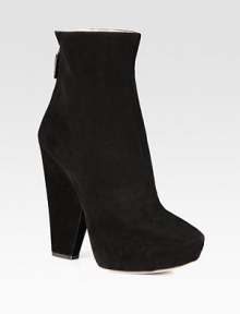 Suede ankle boot with geometric heel and hidden platform. Suede-covered heel, 5½ (140mm)Hidden platform, 1½ (40mm)Compares to a 4 heel (100mm)Suede upperBack zipLeather liningLeather and rubber solePadded insoleMade in Italy
