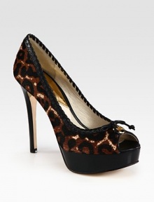 A feline-inspired print covers this calf hair pump with leather trim and a stacked platform. Stacked heel, 4¾ (120mm)Stacked platform, 1¼ (30mm)Compares to a 3½ heel (90mm)Leopard-print calf hair upper with leather trimPeep toeLeather lining and solePadded insoleImported A feline-inspired print covers this calf hair pump with leather trim and a stacked platform. Stacked heel, 4¾ (120mm)Stacked platform, 1¼ (30mm)Compares to a 3½ heel (90mm)Leopard-print calf hair upper with leather trimPeep toeLeather lining and solePadded insoleImported
