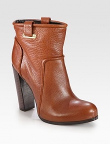Towering, street-cool boot rendered in pebbled leather with shiny goldtone accents. Stacked heel, 4½ (115mm)Hidden platform, ¾ (20mm)Compares to a 3¾ heel (95mm)Leather upper with metal accentsLeather lining and solePadded insoleImported Towering, street-cool boot rendered in pebbled leather with shiny goldtone accents. Stacked heel, 4½ (115mm)Hidden platform, ¾ (20mm)Compares to a 3¾ heel (95mm)Leather upper with metal accentsLeather lining and solePadded insoleImported