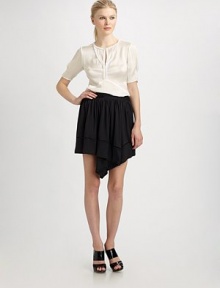 Satin-faced georgette rendered in a romantic silhouette.Loop-trim neckline Pleated short sleeves Bust darts About 25 from shoulder to hem Silk; dry clean Made in USA Satin-faced georgette rendered in a romantic silhouette.Loop-trim neckline Pleated short sleeves Bust darts About 25 from shoulder to hem Silk; dry clean Made in USA