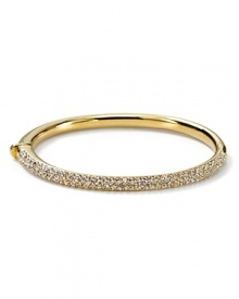 The slender bangle from Nadri is crafted in polished rhodium plate with a triple-row of gleaming crystal pave to a bring a touch of light. The slender bangle from Nadri is crafted in polished rhodium plate with a triple-row of gleaming crystal pave to a bring a touch of light.