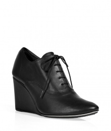 Channel trend-right style in these lace-up wedges from Repetto - Round toe, lace-up front, wedge heel - Style with pleat-front shorts, a tie-neck blouse, and an oversized cardigan Channel trend-right style in these lace-up wedges from Repetto - Round toe, lace-up front, wedge heel - Style with pleat-front shorts, a tie-neck blouse, and an oversized cardigan