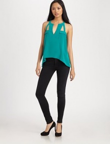 Finished with a slight hi-low hem, this fluid silk v-neck has architectural straps and edgy cutouts. V-neckSleevelessElasticized drop waistCutout backHi-low hemSilkDry cleanImportedModel shown is 5'10 (177cm) wearing US size Small. Finished with a slight hi-low hem, this fluid silk v-neck has architectural straps and edgy cutouts. V-neckSleevelessElasticized drop waistCutout backHi-low hemSilkDry cleanImportedModel shown is 5'10 (177cm) wearing US size Small.