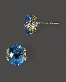 Faceted blue topaz in intricate 14K yellow gold settings. Faceted blue topaz in intricate 14K yellow gold settings.