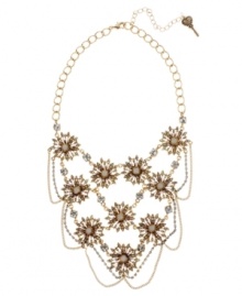 Blooming style, by Betsey Johnson. This statement necklace features multi-linked flower pendants encrusted with crystal accents. Crafted in antique gold-plated mixed metal with crystal cup chain details. Approximate length: 16 inches + 3-inch extender. Approximate drop: 4-1/2 inches. Blooming style, by Betsey Johnson. This statement necklace features multi-linked flower pendants encrusted with crystal accents. Crafted in antique gold-plated mixed metal with crystal cup chain details. Approximate length: 16 inches + 3-inch extender. Approximate drop: 4-1/2 inches.