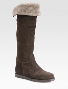 Infused with comfortable shearling lining, this suede knee-high design has grosgrain ribbon trim and a rubber sole. Rubber heel, 1 (25mm)Shaft, 18Leg circumference, 14Suede and grosgrain ribbon upperPull-on styleShearling liningRubber solePadded insoleMade in Italy