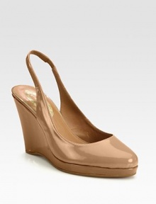 Classically fashionable wardrobe favorite of lustrous patent leather on an elevated wedge and platform. Patent leather wedge, 3¾ (95mm)Patent leather platform, ¾ (20mm)Compares to a 3 heel (75mm)Patent leather upperLeather lining and solePadded insoleImportedOUR FIT MODEL RECOMMENDS ordering one half size up as this style runs small. Classically fashionable wardrobe favorite of lustrous patent leather on an elevated wedge and platform. Patent leather wedge, 3¾ (95mm)Patent leather platform, ¾ (20mm)Compares to a 3 heel (75mm)Patent leather upperLeather lining and solePadded insoleImportedOUR FIT MODEL RECOMMENDS ordering one half size up as this style runs small.