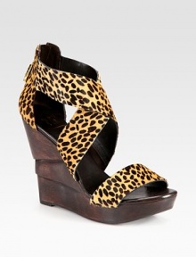 Architectural, wooden wedge topped with leopard-print calf hair straps and an exposed back zipper. Wooden wedge, 4½ (115mm)Wooden platform, 1 (25mm)Compares to a 3½ heel (90mm)Leopard-print calf hair upperBack zipperLeather liningRubber solePadded insoleImportedOUR FIT MODEL RECOMMENDS ordering true size. Architectural, wooden wedge topped with leopard-print calf hair straps and an exposed back zipper. Wooden wedge, 4½ (115mm)Wooden platform, 1 (25mm)Compares to a 3½ heel (90mm)Leopard-print calf hair upperBack zipperLeather liningRubber solePadded insoleImportedOUR FIT MODEL RECOMMENDS ordering true size.