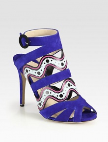 Beautifully cut suede design accentuated by sexy cutouts, a towering heel and vivid painted leather trim. Self-covered heel, 4½ (115mm)Suede and painted leather upperAdjustable ankle strapLeather lining and solePadded insoleMade in Italy Beautifully cut suede design accentuated by sexy cutouts, a towering heel and vivid painted leather trim. Self-covered heel, 4½ (115mm)Suede and painted leather upperAdjustable ankle strapLeather lining and solePadded insoleMade in Italy