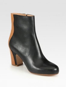 Expert craftsmanship defines this tonal ankle boot in supple Italian leather. Self-covered heel, 3 (75mm)Hidden platform, ¾ (20mm)Compares to a 2¼ heel, (60mm)Leather upperSide zipLeather lining and solePadded insoleMade in Italy Expert craftsmanship defines this tonal ankle boot in supple Italian leather. Self-covered heel, 3 (75mm)Hidden platform, ¾ (20mm)Compares to a 2¼ heel, (60mm)Leather upperSide zipLeather lining and solePadded insoleMade in Italy