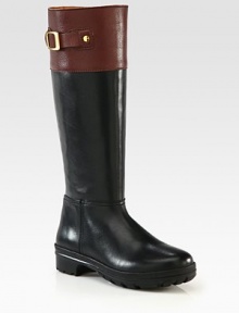 Buckled hardware tops this two-tone leather boot with an easy side zip and rubber sole. Rubber heel, 1 (25mm)Shaft, 14¾Leg circumference, 14Leather upperSide zipLeather liningRubber trek solePadded insoleImported Buckled hardware tops this two-tone leather boot with an easy side zip and rubber sole. Rubber heel, 1 (25mm)Shaft, 14¾Leg circumference, 14Leather upperSide zipLeather liningRubber trek solePadded insoleImported
