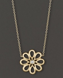 Diamonds bloom in an elegant 18K yellow gold setting. By Carelle. Diamonds bloom in an elegant 18K yellow gold setting. By Carelle.
