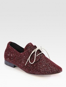 Youthful silhouette of glitter-coated canvas topped with laces for on-the-go style. Glitter-coated canvas upperCanvas liningLeather solePadded insoleMade in Italy Youthful silhouette of glitter-coated canvas topped with laces for on-the-go style. Glitter-coated canvas upperCanvas liningLeather solePadded insoleMade in Italy
