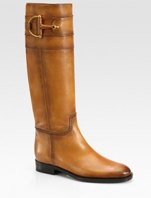 Leather design with stitch accents and signature horsebit hardware. Stacked heel, 1 (25mm)Shaft, 16Leg circumference, 14¼Leather upperPull-on styleLeather lining and solePadded insoleMade in Italy Leather design with stitch accents and signature horsebit hardware. Stacked heel, 1 (25mm)Shaft, 16Leg circumference, 14¼Leather upperPull-on styleLeather lining and solePadded insoleMade in Italy