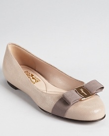 In micro-grid textured patent, Salvatore Ferragamo's classic Varina flat feels fresh for the season. In micro-grid textured patent, Salvatore Ferragamo's classic Varina flat feels fresh for the season.