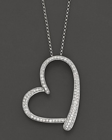 Diamonds gleam from a 14K white gold heart pendant. Diamonds gleam from a 14K white gold heart pendant.