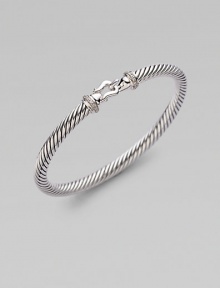 From the Cable Buckle Collection. A signature cable of sterling silver in a graceful bangle with a buckle clasp, accented with pavé diamonds. Diamonds, .10 tcw Sterling silver Cable, 5mm Diameter, about 2¼ Hook clasp Made in USA From the Cable Buckle Collection. A signature cable of sterling silver in a graceful bangle with a buckle clasp, accented with pavé diamonds. Diamonds, .10 tcw Sterling silver Cable, 5mm Diameter, about 2¼ Hook clasp Made in USA