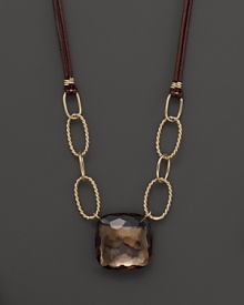 Hammer faceted cushion cut smoky quartz adds rich sparkle to leather and links of 14K yellow gold. By Nancy B. Hammer faceted cushion cut smoky quartz adds rich sparkle to leather and links of 14K yellow gold. By Nancy B.