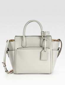 An elegant zip-top tote designed to balance function and luxury with soft geometry.Double top handles, 4½ dropDetachable adjustable shoulder strap, 21½-23 dropTop zip closureThree outside open pocketsOne detachable zip pouchOne inside zip pocketTwo inside open pockets9½W X 10H X 5DImported An elegant zip-top tote designed to balance function and luxury with soft geometry.Double top handles, 4½ dropDetachable adjustable shoulder strap, 21½-23 dropTop zip closureThree outside open pocketsOne detachable zip pouchOne inside zip pocketTwo inside open pockets9½W X 10H X 5DImported