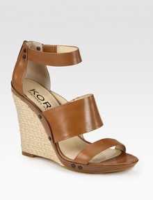 Substantial espadrille wedge accompanied by studded leather straps and an exposed back zipper. Braided hemp wedge, 4 (100mm)Leather upperLeather lining and solePadded insoleImported Substantial espadrille wedge accompanied by studded leather straps and an exposed back zipper. Braided hemp wedge, 4 (100mm)Leather upperLeather lining and solePadded insoleImported
