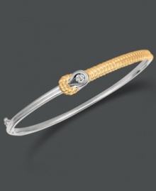 This Everlon bracelet will add a touch of elegance every time you slip it comfortably over your wrist. Bracelet features a single diamond (1/7 ct. t.w.) set in 14k gold and sterling silver. Approximate diameter: 2-1/2 inches. This Everlon bracelet will add a touch of elegance every time you slip it comfortably over your wrist. Bracelet features a single diamond (1/7 ct. t.w.) set in 14k gold and sterling silver. Approximate diameter: 2-1/2 inches.