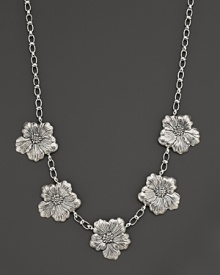 Delicate gardenias, captured at the height of their beauty in sterling silver, bloom on this necklace from Buccellati.
