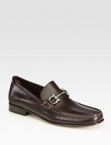 Timeless slip-on articulated in sleek calfskin with iconic gancini ornament.Calfskin upperLeather liningPadded insoleLeather soleMade in Italy Timeless slip-on articulated in sleek calfskin with iconic gancini ornament.Calfskin upperLeather liningPadded insoleLeather soleMade in Italy