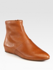 Finesse your look with this clean silhouette of buttery leather. Leather upperSide zipLeather lining and solePadded insoleImportedOUR FIT MODEL RECOMMENDS ordering one half size up as this style runs small. Finesse your look with this clean silhouette of buttery leather. Leather upperSide zipLeather lining and solePadded insoleImportedOUR FIT MODEL RECOMMENDS ordering one half size up as this style runs small.