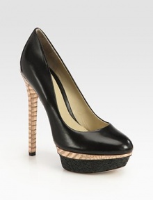 A textured raffia platform takes this leather pump with metallic snake-print accents to new style heights. Metallic snake-print leather heel, 5¾ (145mm)Raffia platform with metallic snake-print leather insert, 1¾ (45mm)Compares to a 4 heel (100mm)Leather upperLeather lining and solePadded insoleImported A textured raffia platform takes this leather pump with metallic snake-print accents to new style heights. Metallic snake-print leather heel, 5¾ (145mm)Raffia platform with metallic snake-print leather insert, 1¾ (45mm)Compares to a 4 heel (100mm)Leather upperLeather lining and solePadded insoleImported
