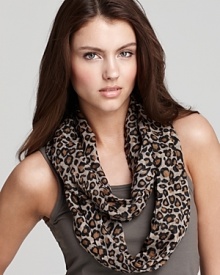 A lightweight loop scarf in a dark tan animal print, a fierce style from Fraas. A lightweight loop scarf in a dark tan animal print, a fierce style from Fraas.