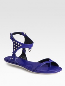 Smooth leather gladiator with rocker-chic studs and an adjustable ankle strap. Leather upperLeather liningRubber solePadded insoleImported Smooth leather gladiator with rocker-chic studs and an adjustable ankle strap. Leather upperLeather liningRubber solePadded insoleImported