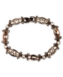 Refresh your look. Givenchy's alluring flex bracelet features silk Swarovski stones. Set in brown gold tone mixed metal. Approximate length: 7-1/4 inches. Refresh your look. Givenchy's alluring flex bracelet features silk Swarovski stones. Set in brown gold tone mixed metal. Approximate length: 7-1/4 inches.