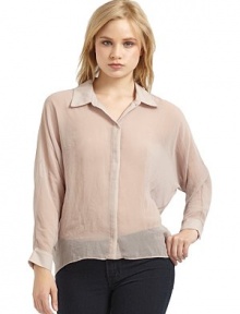 THE LOOKShirt collarFront snap closureLong dolman sleeves with snap cuffsSheer designShirttail hemTHE FITAbout 24 from shoulder to hemTHE MATERIALPoly georgetteCARE & ORIGINDry cleanMade in USAModel shown is 5'8½ (174cm) wearing US size Small. THE LOOKShirt collarFront snap closureLong dolman sleeves with snap cuffsSheer designShirttail hemTHE FITAbout 24 from shoulder to hemTHE MATERIALPoly georgetteCARE & ORIGINDry cleanMade in USAModel shown is 5'8½ (174cm) wearing US size Small.