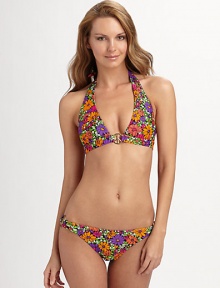 An oversized goldtone peace ring serves as the centerpiece for this feminine floral halter knit.Halter straps tie at nape Goldtone center peace ring Back tie closure Fully lined 82% nylon/18% spandex Fully lined Hand wash Made in USA of imported fabricPlease note: Bikini bottom sold separately. An oversized goldtone peace ring serves as the centerpiece for this feminine floral halter knit.Halter straps tie at nape Goldtone center peace ring Back tie closure Fully lined 82% nylon/18% spandex Fully lined Hand wash Made in USA of imported fabricPlease note: Bikini bottom sold separately.