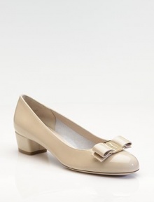 A lustrous patent leather style features lovely bow detail and signature hardware at the round toe.Self-covered chunky heel, 1¾ (45mm) Leather lining and sole Padded insole Made in ItalyOUR FIT MODEL RECOMMENDS ordering true size.. 