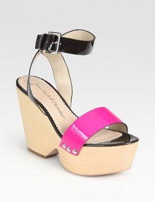 Clog-inspired wooden wedge updated by colorblocked patent leather and an adjustable ankle strap. Wooden wedge, 4 (100mm)Wooden platform, 2 (50mm)Compares to a 2 heel (50mm)Patent leather upperLeather lining and solePadded insoleImported Clog-inspired wooden wedge updated by colorblocked patent leather and an adjustable ankle strap. Wooden wedge, 4 (100mm)Wooden platform, 2 (50mm)Compares to a 2 heel (50mm)Patent leather upperLeather lining and solePadded insoleImported